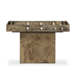 Inspired by Brutalist design, this outdoor foosball table is constructed of industrial oxidized aluminum panels, framing a travertine play surface atop a monolith plinth base that highlights the character of the finish. Two-toned players are cast in solid aluminum. Cover or store indoors during inclement weather and when not in use. Amethyst Home provides interior design, new home construction design consulting, vintage area rugs, and lighting in the Kansas City metro area.