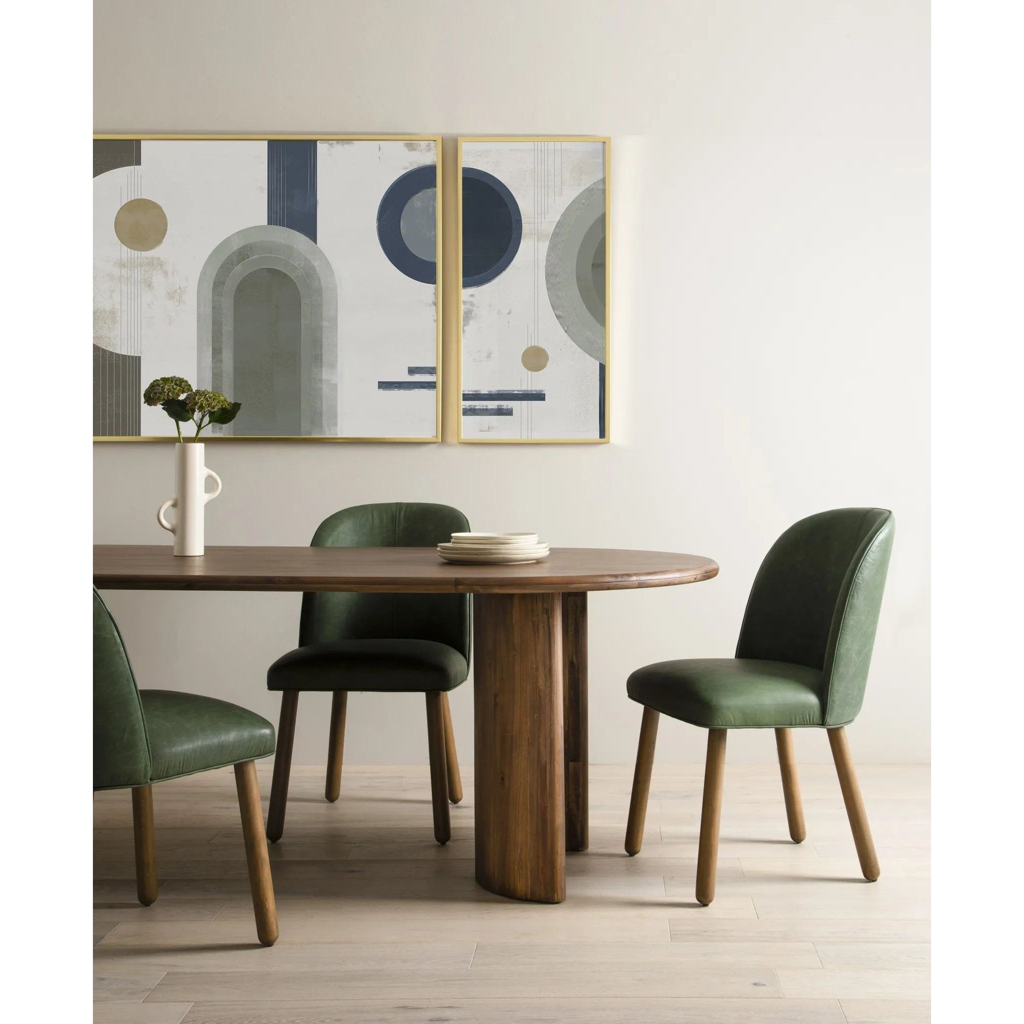 A study in shape. Solid brown acacia forms crescent-shaped legs and sprawling oval tabletop, bringing organic presence to the dining room Amethyst Home provides interior design, new home construction design consulting, vintage area rugs, and lighting in the Laguna Beach metro area.