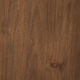 A study in shape. Solid brown acacia forms crescent-shaped legs and sprawling oval tabletop, bringing organic presence to the dining room Amethyst Home provides interior design, new home construction design consulting, vintage area rugs, and lighting in the Park City metro area.