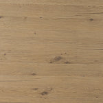 A study in shape. Solid brown oak forms crescent-shaped legs and sprawling oval tabletop, bringing organic presence to the dining room Amethyst Home provides interior design, new home construction design consulting, vintage area rugs, and lighting in the Park City metro area.
