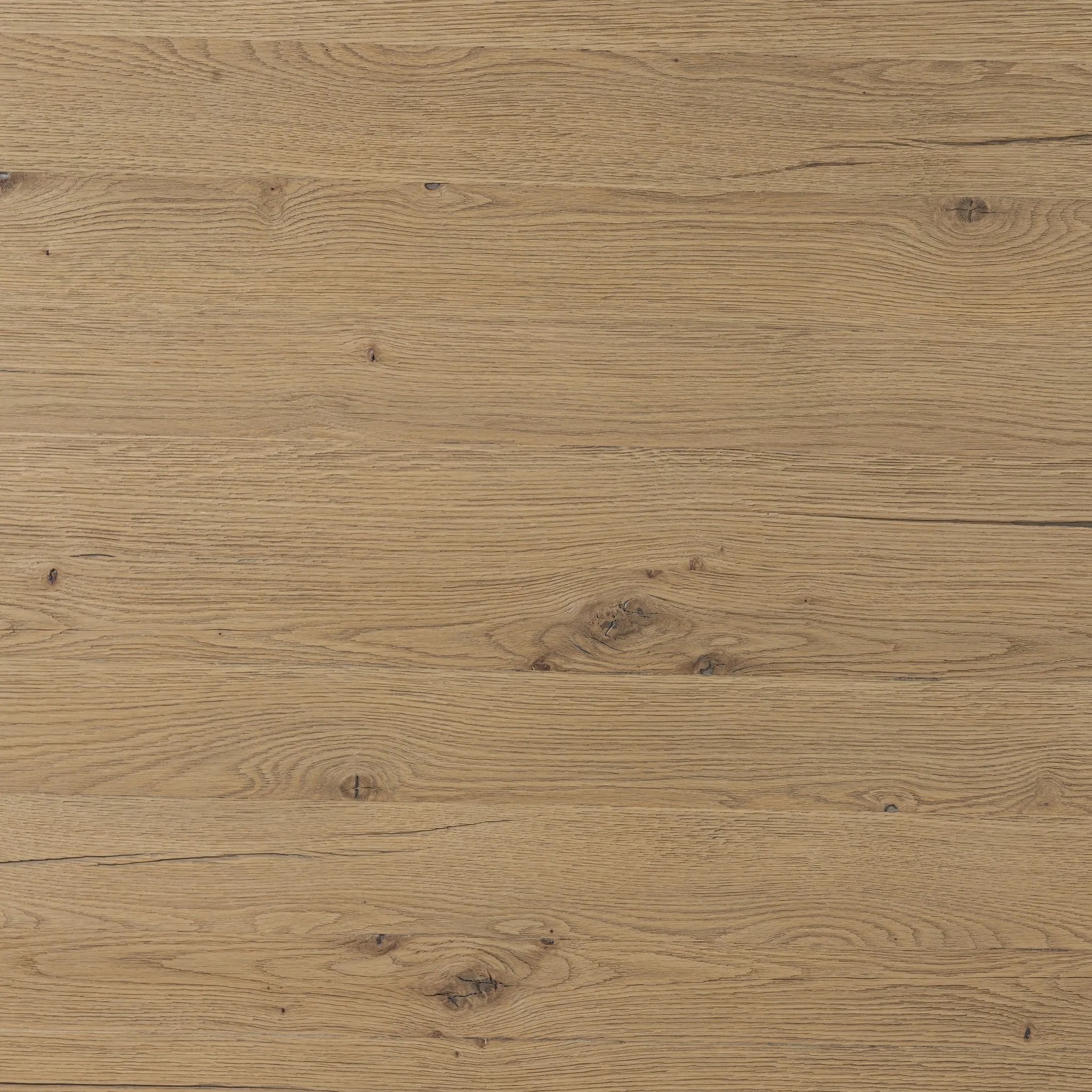 A study in shape. Solid brown oak forms crescent-shaped legs and sprawling oval tabletop, bringing organic presence to the dining room Amethyst Home provides interior design, new home construction design consulting, vintage area rugs, and lighting in the Park City metro area.