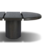 Make space for more guests with a rounded extension table of smoked black mindi, with beautiful visible graining. Inside the tabletop, a hidden mechanism allows for expansion from 48" to 68".As fans of organic modern design at Amethyst, we love the designer inspired Pemble Extension Dining Table - Smoked Black Mindi Veneer. Amethyst Home provides interior design, new home construction design consulting, vintage area rugs, and lighting in the Alpharetta metro area.