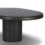 Make space for more guests with a rounded extension table of smoked black mindi, with beautiful visible graining. Inside the tabletop, a hidden mechanism allows for expansion from 48" to 68".As fans of organic modern design at Amethyst, we love the designer inspired Pemble Extension Dining Table - Smoked Black Mindi Veneer. Amethyst Home provides interior design, new home construction design consulting, vintage area rugs, and lighting in the Calabasas metro area.