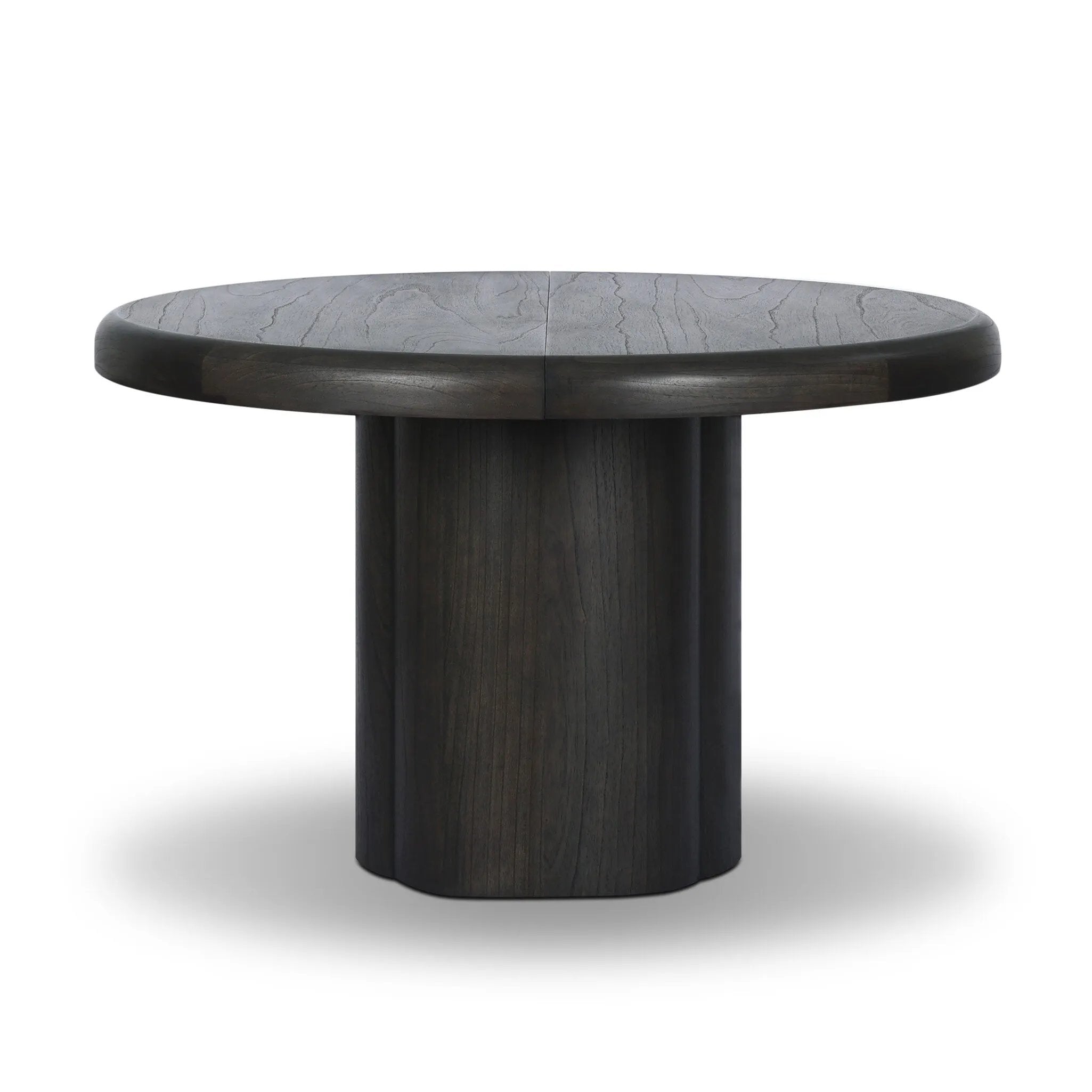 Make space for more guests with a rounded extension table of smoked black mindi, with beautiful visible graining. Inside the tabletop, a hidden mechanism allows for expansion from 48" to 68".As fans of organic modern design at Amethyst, we love the designer inspired Pemble Extension Dining Table - Smoked Black Mindi Veneer. Amethyst Home provides interior design, new home construction design consulting, vintage area rugs, and lighting in the Dallas metro area.