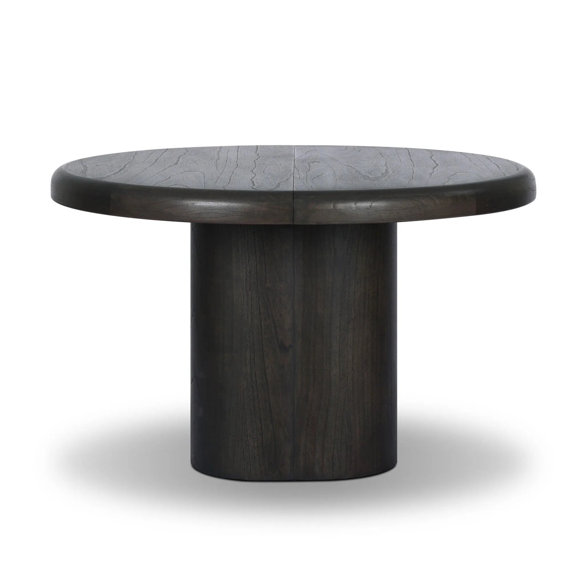 Make space for more guests with a rounded extension table of smoked black mindi, with beautiful visible graining. Inside the tabletop, a hidden mechanism allows for expansion from 48" to 68".As fans of organic modern design at Amethyst, we love the designer inspired Pemble Extension Dining Table - Smoked Black Mindi Veneer. Amethyst Home provides interior design, new home construction design consulting, vintage area rugs, and lighting in the Salt Lake City metro area.