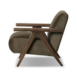 Contemporary outfitting of a vintage chair design offers easy comfort. Upholstered in velvety olive green, the wooden frame is finished in a vintage ash hue. Ideally placed as an accent chair or in pairs Amethyst Home provides interior design, new home construction design consulting, vintage area rugs, and lighting in the Charlotte metro area.