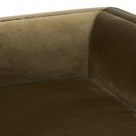 A clean, angular sectional in an eye-catching color. Upholstered in an olive cotton blend, with blind stitching along the seat and back cushions. The slight pronounced seat cushion creates an illusion of being loose, but is actually a fixed cushion with expert tailoring. A piping channel detail gives the arm a finished look Amethyst Home provides interior design, new home construction design consulting, vintage area rugs, and lighting in the Austin metro area.