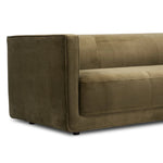 A clean, angular sectional in an eye-catching color. Upholstered in an olive cotton blend, with blind stitching along the seat and back cushions. The slight pronounced seat cushion creates an illusion of being loose, but is actually a fixed cushion with expert tailoring. A piping channel detail gives the arm a finished look Amethyst Home provides interior design, new home construction design consulting, vintage area rugs, and lighting in the Des Moines metro area.