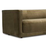 A clean, angular sectional in an eye-catching color. Upholstered in an olive cotton blend, with blind stitching along the seat and back cushions. The slight pronounced seat cushion creates an illusion of being loose, but is actually a fixed cushion with expert tailoring. A piping channel detail gives the arm a finished look Amethyst Home provides interior design, new home construction design consulting, vintage area rugs, and lighting in the Des Moines metro area.