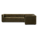 A clean, angular sectional in an eye-catching color. Upholstered in an olive cotton blend, with blind stitching along the seat and back cushions. The slight pronounced seat cushion creates an illusion of being loose, but is actually a fixed cushion with expert tailoring. A piping channel detail gives the arm a finished look Amethyst Home provides interior design, new home construction design consulting, vintage area rugs, and lighting in the Tampa metro area.