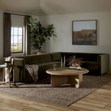 A clean, angular sectional in an eye-catching color. Upholstered in an olive cotton blend, with blind stitching along the seat and back cushions. The slight pronounced seat cushion creates an illusion of being loose, but is actually a fixed cushion with expert tailoring. A piping channel detail gives the arm a finished look Amethyst Home provides interior design, new home construction design consulting, vintage area rugs, and lighting in the Washington metro area.