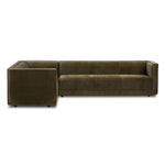 A clean, angular sectional in an eye-catching color. Upholstered in an olive cotton blend, with blind stitching along the seat and back cushions. The slight pronounced seat cushion creates an illusion of being loose, but is actually a fixed cushion with expert tailoring. A piping channel detail gives the arm a finished look Amethyst Home provides interior design, new home construction design consulting, vintage area rugs, and lighting in the Miami metro area.
