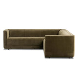 A clean, angular sectional in an eye-catching color. Upholstered in an olive cotton blend, with blind stitching along the seat and back cushions. The slight pronounced seat cushion creates an illusion of being loose, but is actually a fixed cushion with expert tailoring. A piping channel detail gives the arm a finished look Amethyst Home provides interior design, new home construction design consulting, vintage area rugs, and lighting in the Washington metro area.