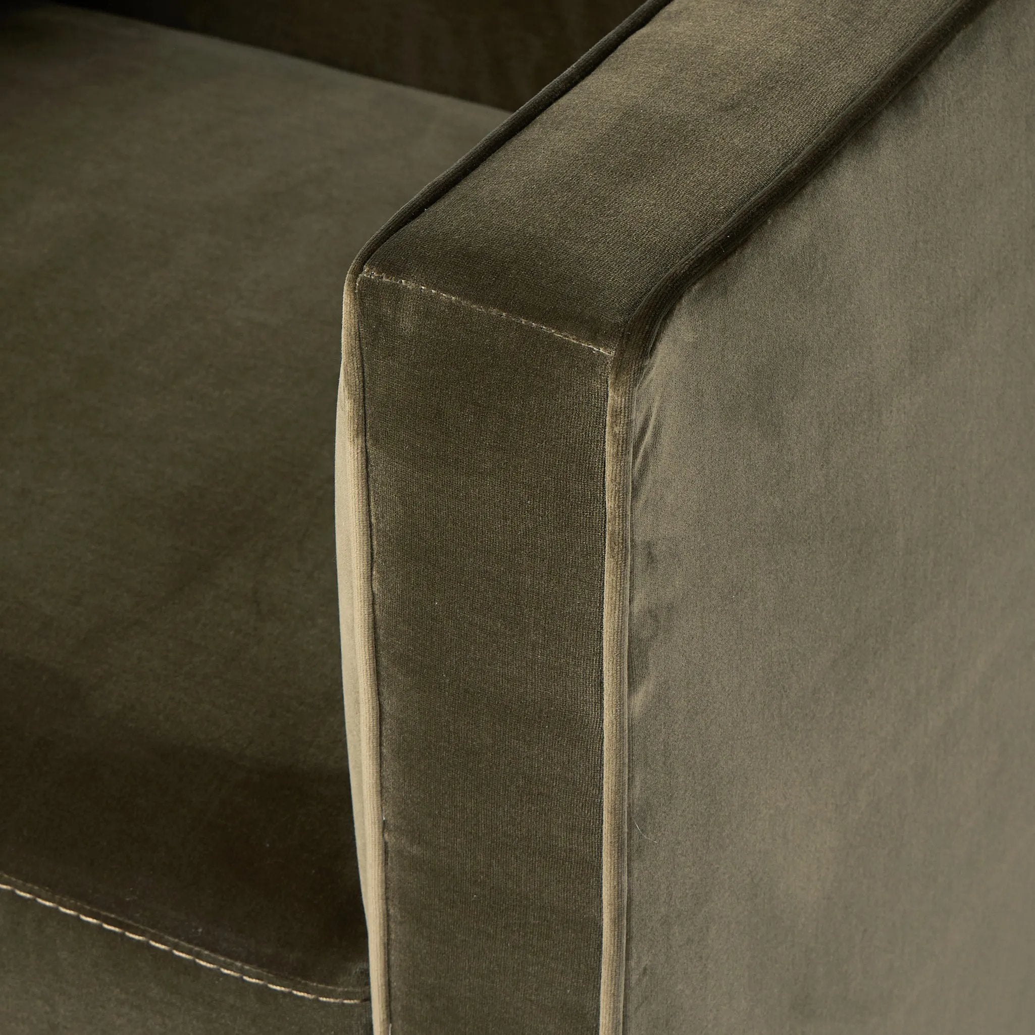 Style meets substance in this olive cotton-blend swivel chair. Blind stitching along the seat and back cushions create a polished complement to the heritage frame. The slight pronounced seat cushion creates an illusion of being loose, but is actually a fixed cushion with expert tailoring. A piping channel detail gives the arm a finished look Amethyst Home provides interior design, new home construction design consulting, vintage area rugs, and lighting in the Kansas City metro area.