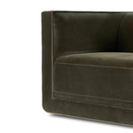 Style meets substance in this olive cotton-blend swivel chair. Blind stitching along the seat and back cushions create a polished complement to the heritage frame. The slight pronounced seat cushion creates an illusion of being loose, but is actually a fixed cushion with expert tailoring. A piping channel detail gives the arm a finished look Amethyst Home provides interior design, new home construction design consulting, vintage area rugs, and lighting in the Scottsdale metro area.