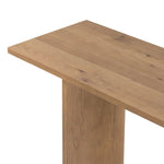 A shape-driven console table made from thick-cut oak veneer features overscale proportions and half-moon shaping, with a warm grey-brown finish Amethyst Home provides interior design, new home construction design consulting, vintage area rugs, and lighting in the Kansas City metro area.