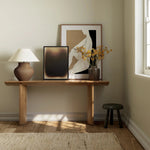 A shape-driven console table made from thick-cut oak veneer features overscale proportions and half-moon shaping, with a warm grey-brown finish Amethyst Home provides interior design, new home construction design consulting, vintage area rugs, and lighting in the Tampa metro area.