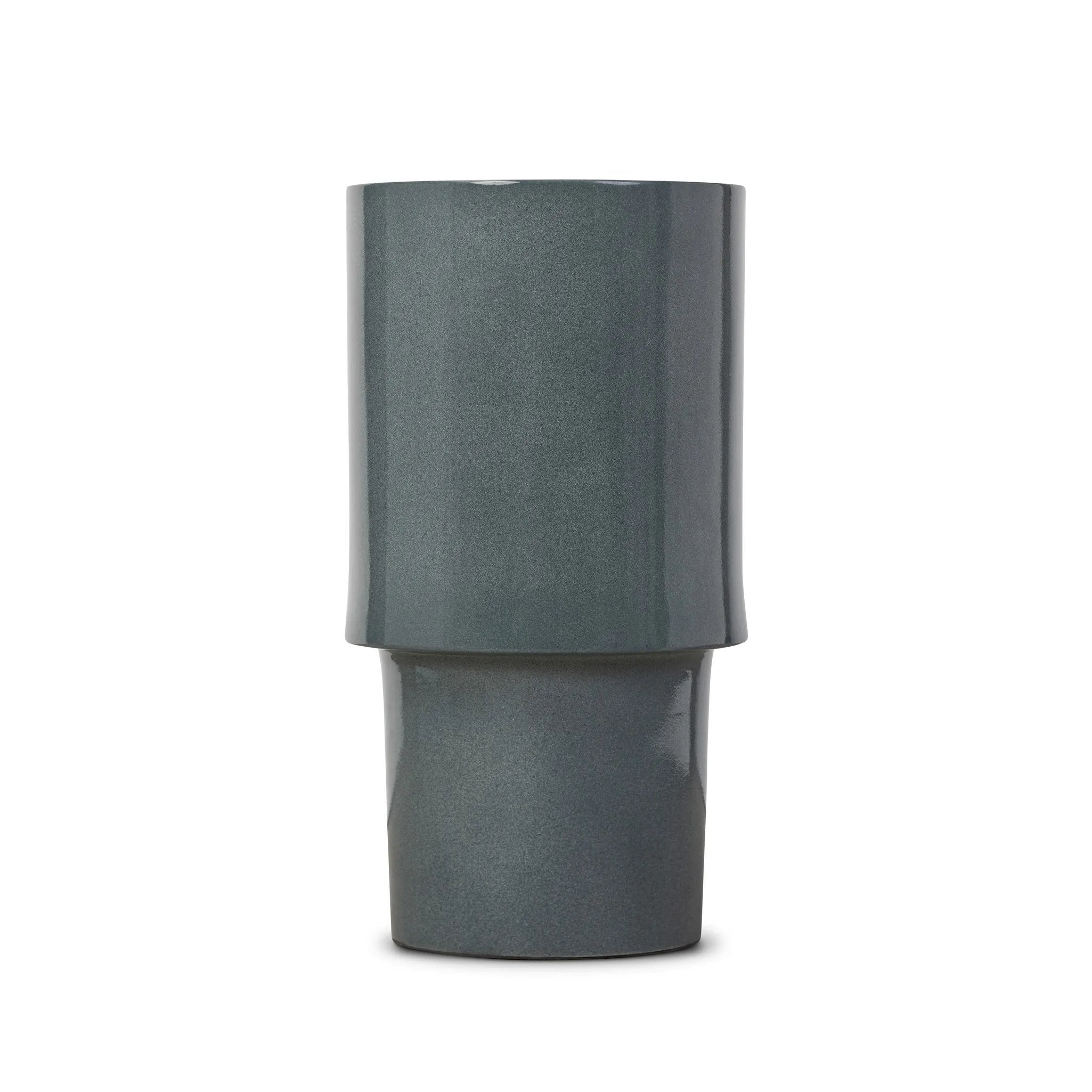 Add an extra surface anywhere with a versatile end table of smooth slate concrete. Its simple shape and smaller scale works into a range of spaces and styles with ease, while a plinth base brings a touch of movement to the whole piece Amethyst Home provides interior design, new home construction design consulting, vintage area rugs, and lighting in the Tampa metro area.