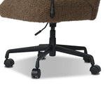 Work in comfort and style with this texture-driven desk chair. Black hammered and forged iron arms frame a seat and back upholstered in a textured weave  fabric. Performance fabrics are specially created to withstand spills, stains, high traffic and wear, ensuring long-term comfort and unmatched durability. Amethyst Home provides interior design, new home construction design consulting, vintage area rugs, and lighting in the Charlotte metro area.