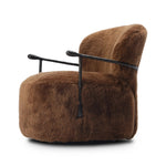 Make a statement with this texture-driven swivel chair. Made from 100% sheared sheepskin. For a unique design detail, black iron arms wrap around the back of the chair and have been hammered for even more texture. A 360-swivel base is inset for a clean look. Amethyst Home provides interior design, new home construction design consulting, vintage area rugs, and lighting in the Austin metro area.