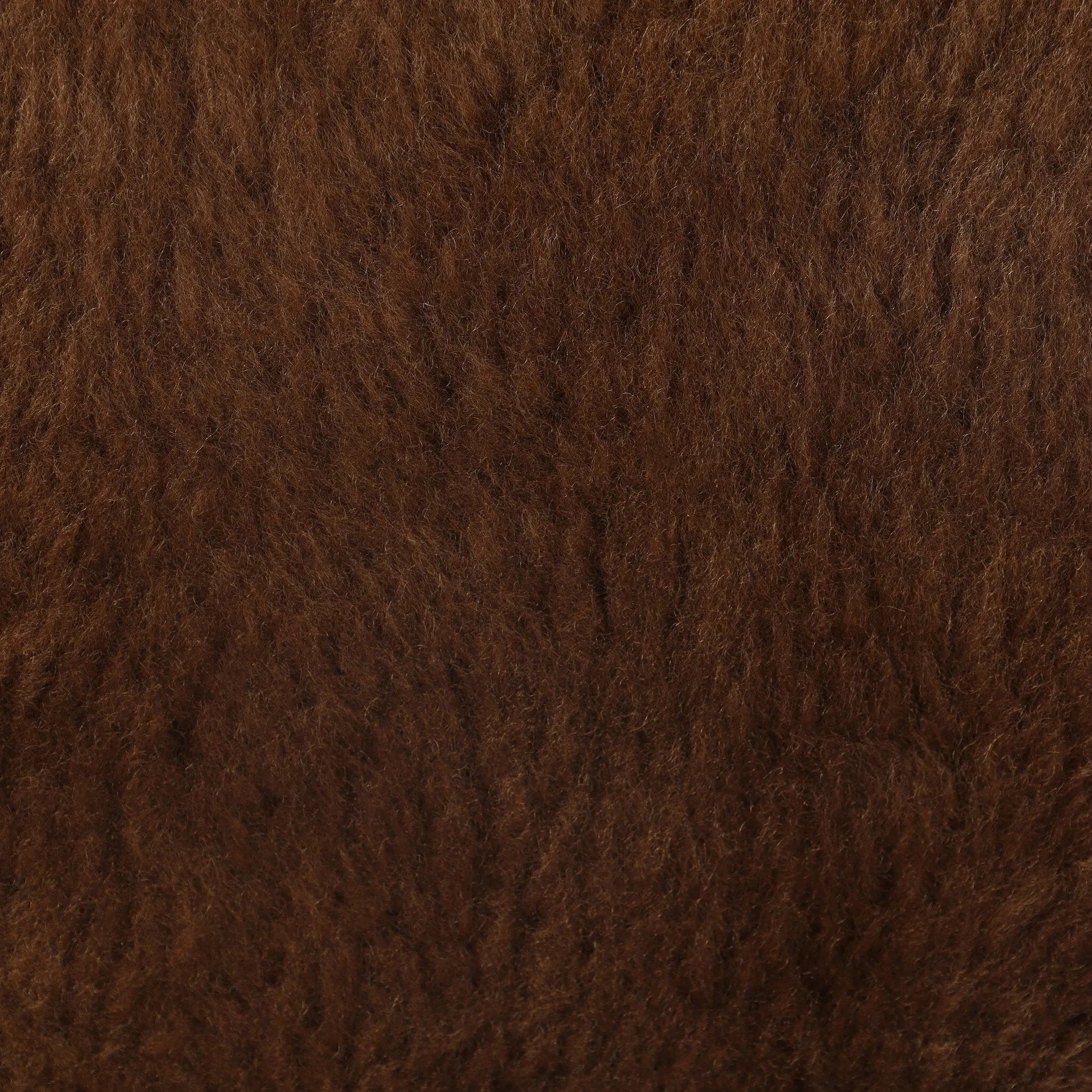 Make a statement with this texture-driven swivel chair. Made from 100% sheared sheepskin. For a unique design detail, black iron arms wrap around the back of the chair and have been hammered for even more texture. A 360-swivel base is inset for a clean look. Amethyst Home provides interior design, new home construction design consulting, vintage area rugs, and lighting in the Boston metro area.