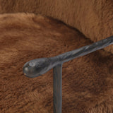 Make a statement with this texture-driven swivel chair. Made from 100% sheared sheepskin. For a unique design detail, black iron arms wrap around the back of the chair and have been hammered for even more texture. A 360-swivel base is inset for a clean look. Amethyst Home provides interior design, new home construction design consulting, vintage area rugs, and lighting in the Charlotte metro area.