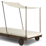 Drawing inspiration from antique rickshaws, this outdoor chaise features wheels and a built-in handle at the front for easy mobility. The adjustable and removable shade canopy offers customizable sun protection, with style. Cover or store inside during inclement weather and when not in use. Amethyst Home provides interior design, new home construction design consulting, vintage area rugs, and lighting in the Monterey metro area.