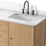 A simple transitional shape designed to function across styles. This bath vanity nods to heritage designs with the softly shaped backsplash, dowel legs, rounded corners and arch frame detail, finished with mixed hardware for added visual interest. Finished with a bath-safe sealant for moisture resistance. Amethyst Home provides interior design, new home construction design consulting, vintage area rugs, and lighting in the Charlotte metro area.