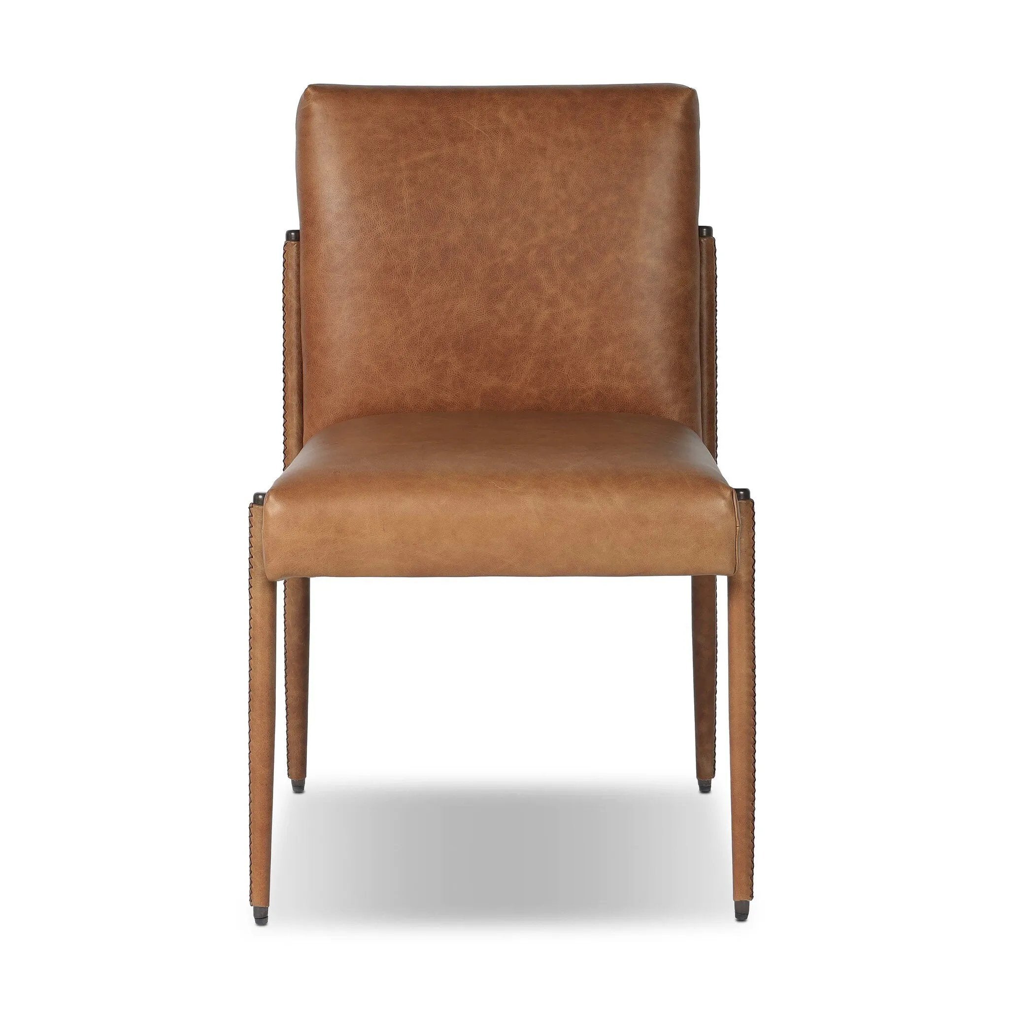 A slim seating style with timeless materials. An armless chair is fully upholstered in butterscotch top-grain leather with a subtle vintage look. Iron legs are also covered in leather, with exposed stitching along each leg.As enthusiasts of luxe design at Amethyst, we love the warm modern inspired Quill Dining Chair. Amethyst Home provides interior design, new home construction design consulting, vintage area rugs, and lighting in the Boston metro area.