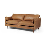 Featuring Reese Palermo Cognac Sofa by Four Hands at Amethyst Home. Effortlessly on-trend. Two-cushion seating of top-grain leather, with knife-edge pillows and welted track arms. Almond-finished legs taper for a modern touch atop midcentury influence.Overall Dimensions: 76.00"w x 35.00"d x 32.75"hWeight : 110.89 lbsMaterials: Top Grain Leather, Poplar Plyw. Amethyst Home provides interior design, new home construction design consulting, vintage area rugs, and lighting in the Nashville metro area.