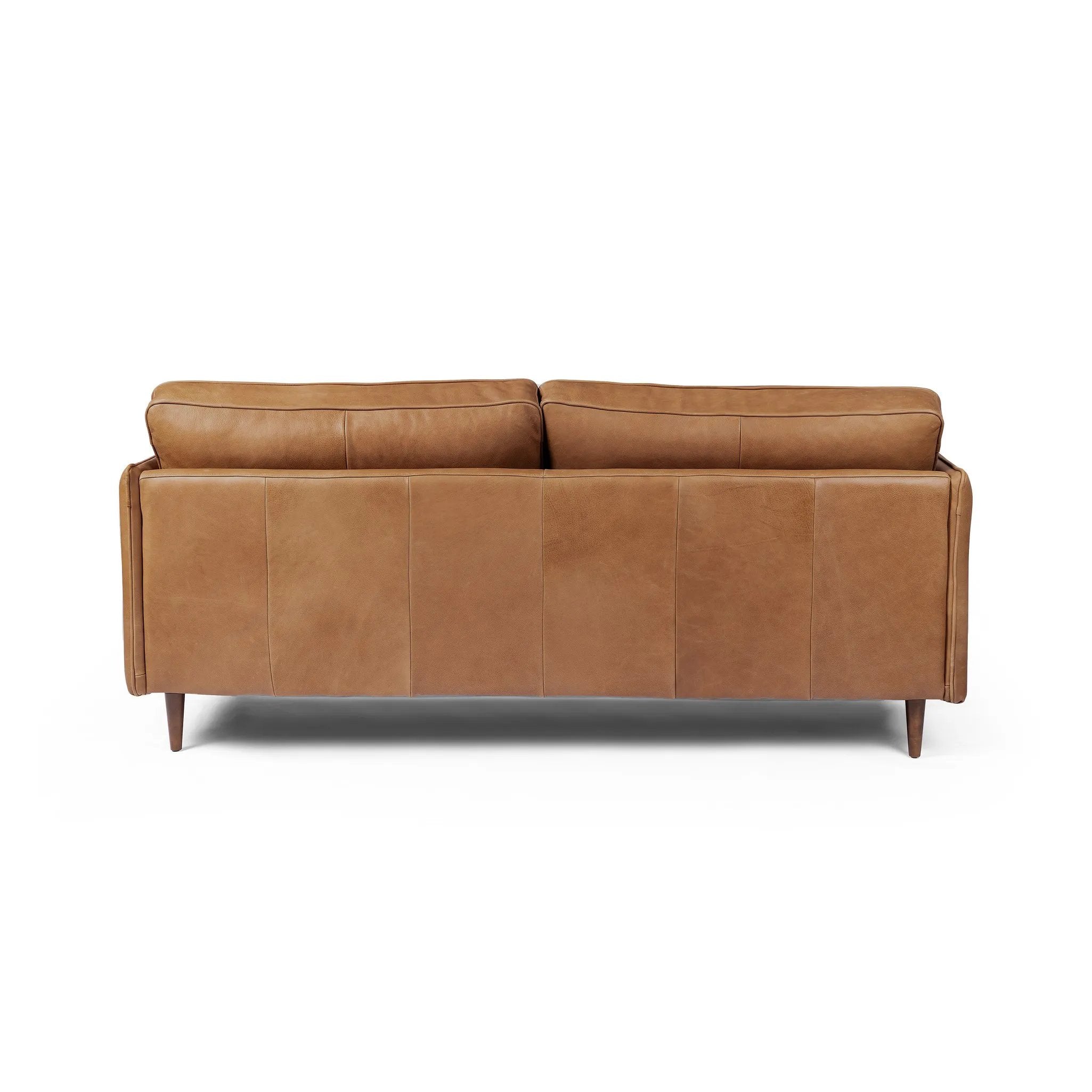 Featuring Reese Palermo Cognac Sofa by Four Hands at Amethyst Home. Effortlessly on-trend. Two-cushion seating of top-grain leather, with knife-edge pillows and welted track arms. Almond-finished legs taper for a modern touch atop midcentury influence.Overall Dimensions: 76.00"w x 35.00"d x 32.75"hWeight : 110.89 lbsMaterials: Top Grain Leather, Poplar Ply. Amethyst Home provides interior design, new home construction design consulting, vintage area rugs, and lighting in the Washington metro area.