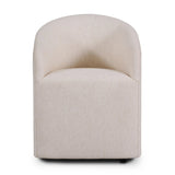 A fully upholstered barrel-style back dining chair creates a comfortable, cocoon-like sit. Slight scale perfect for smaller dining spaces Amethyst Home provides interior design, new home construction design consulting, vintage area rugs, and lighting in the San Diego metro area.