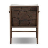Inset panels of solid teak root are laminated to create a mosaic look against beautiful natural graining. Between angled armrests, cushioned seating is upholstered in a durable Italian fabric for an elevated look with a linen hand feel. Amethyst Home provides interior design, new home construction design consulting, vintage area rugs, and lighting in the Boston metro area.