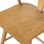 A fresh, bar-style take on mid-century Windsor seating, featuring a bowed, sculptural silhouette and soft black finish to highlight the natural grain of weathered oak Amethyst Home provides interior design, new home construction design consulting, vintage area rugs, and lighting in the Alpharetta metro area.