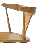 A fresh, bar-style take on mid-century Windsor seating, featuring a bowed, sculptural silhouette and soft black finish to highlight the natural grain of weathered oak Amethyst Home provides interior design, new home construction design consulting, vintage area rugs, and lighting in the Charlotte metro area.