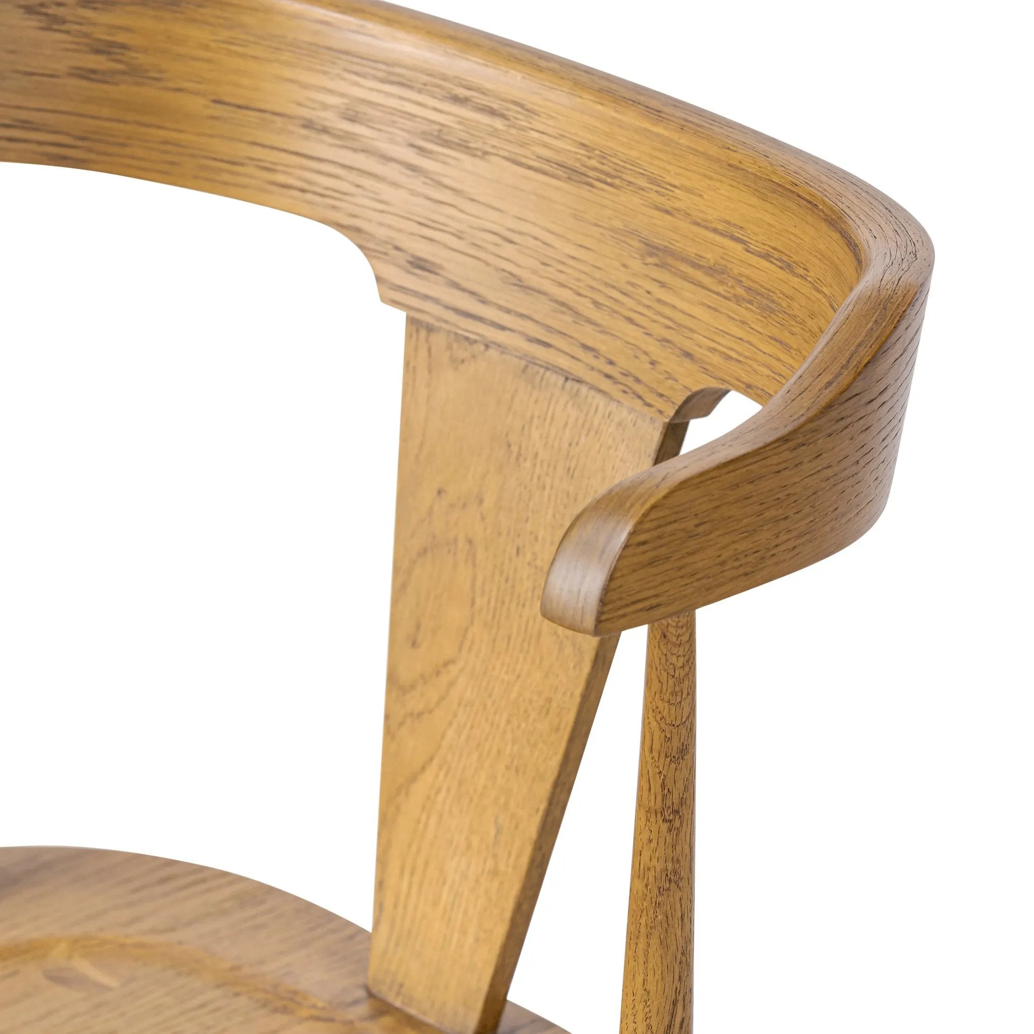 A fresh, bar-style take on mid-century Windsor seating, featuring a bowed, sculptural silhouette and soft black finish to highlight the natural grain of weathered oak Amethyst Home provides interior design, new home construction design consulting, vintage area rugs, and lighting in the Kansas City metro area.