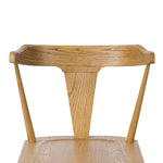 A fresh, bar-style take on mid-century Windsor seating, featuring a bowed, sculptural silhouette and soft black finish to highlight the natural grain of weathered oak Amethyst Home provides interior design, new home construction design consulting, vintage area rugs, and lighting in the Los Angeles metro area.