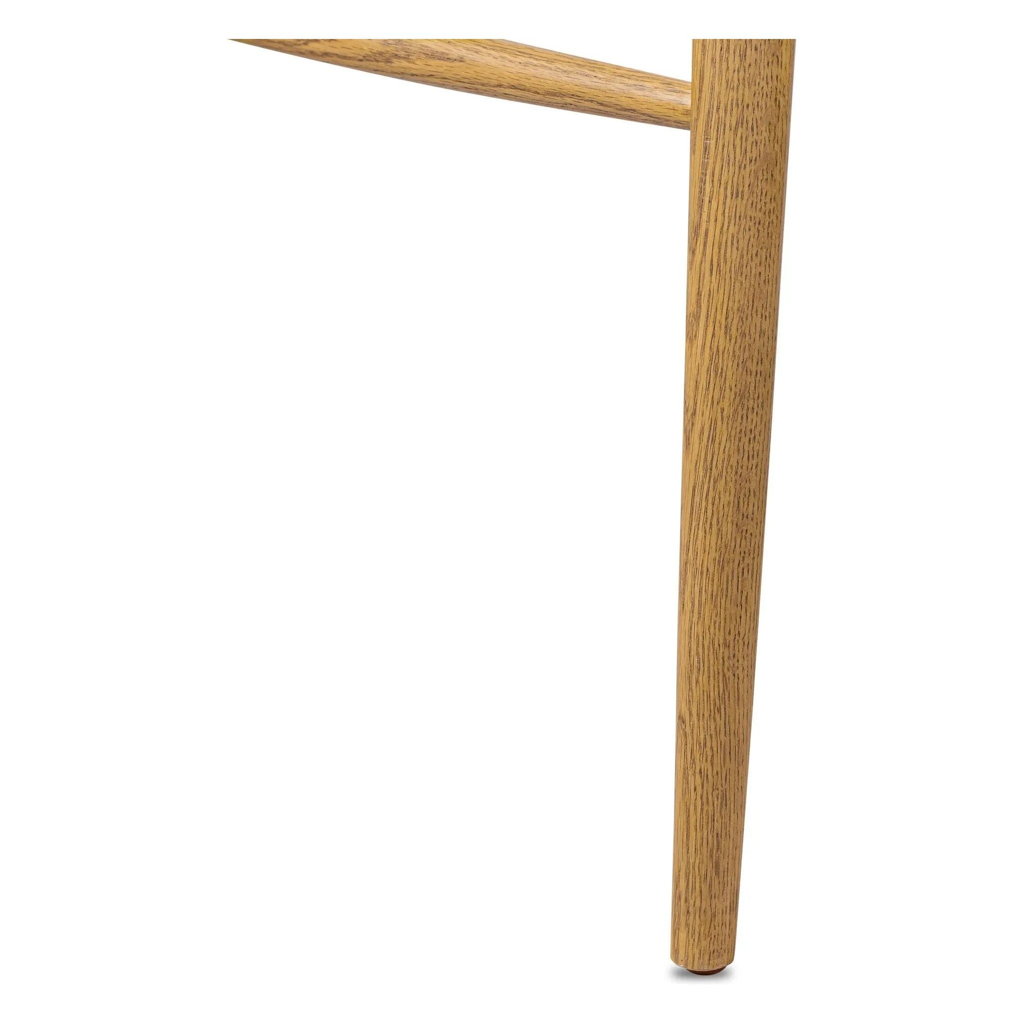 A fresh, bar-style take on mid-century Windsor seating, featuring a bowed, sculptural silhouette and soft black finish to highlight the natural grain of weathered oak Amethyst Home provides interior design, new home construction design consulting, vintage area rugs, and lighting in the Miami metro area.