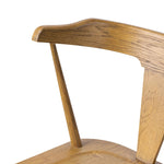A fresh, bar-style take on mid-century Windsor seating, featuring a bowed, sculptural silhouette and soft black finish to highlight the natural grain of weathered oak Amethyst Home provides interior design, new home construction design consulting, vintage area rugs, and lighting in the Newport Beach metro area.