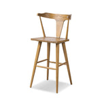 A fresh, bar-style take on mid-century Windsor seating, featuring a bowed, sculptural silhouette and soft black finish to highlight the natural grain of weathered oak Amethyst Home provides interior design, new home construction design consulting, vintage area rugs, and lighting in the Omaha metro area.