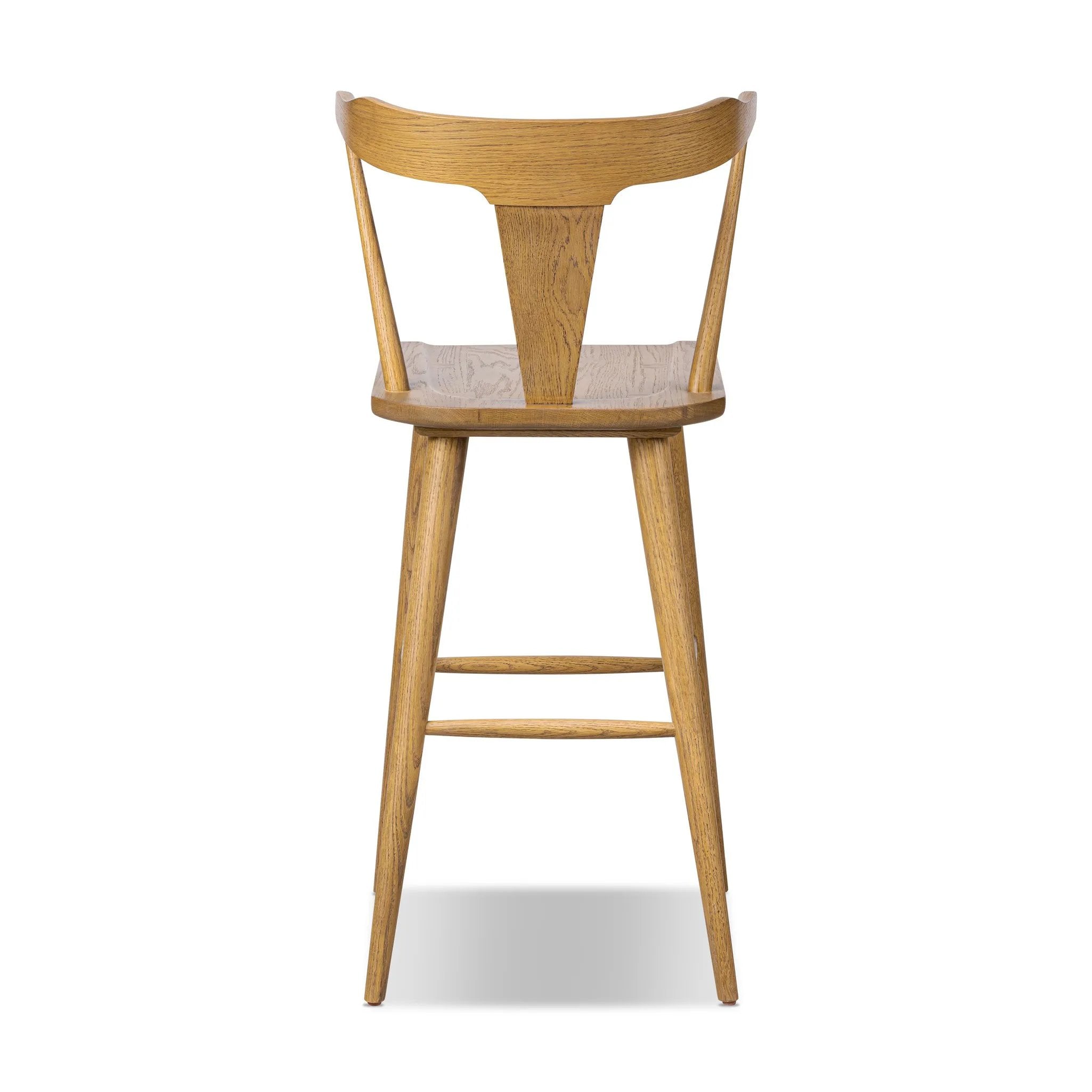 A fresh, bar-style take on mid-century Windsor seating, featuring a bowed, sculptural silhouette and soft black finish to highlight the natural grain of weathered oak Amethyst Home provides interior design, new home construction design consulting, vintage area rugs, and lighting in the Scottsdale metro area.