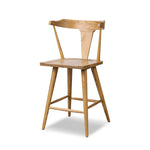 A fresh, bar-style take on mid-century Windsor seating, featuring a bowed, sculptural silhouette and soft black finish to highlight the natural grain of weathered oak Amethyst Home provides interior design, new home construction design consulting, vintage area rugs, and lighting in the Seattle metro area.