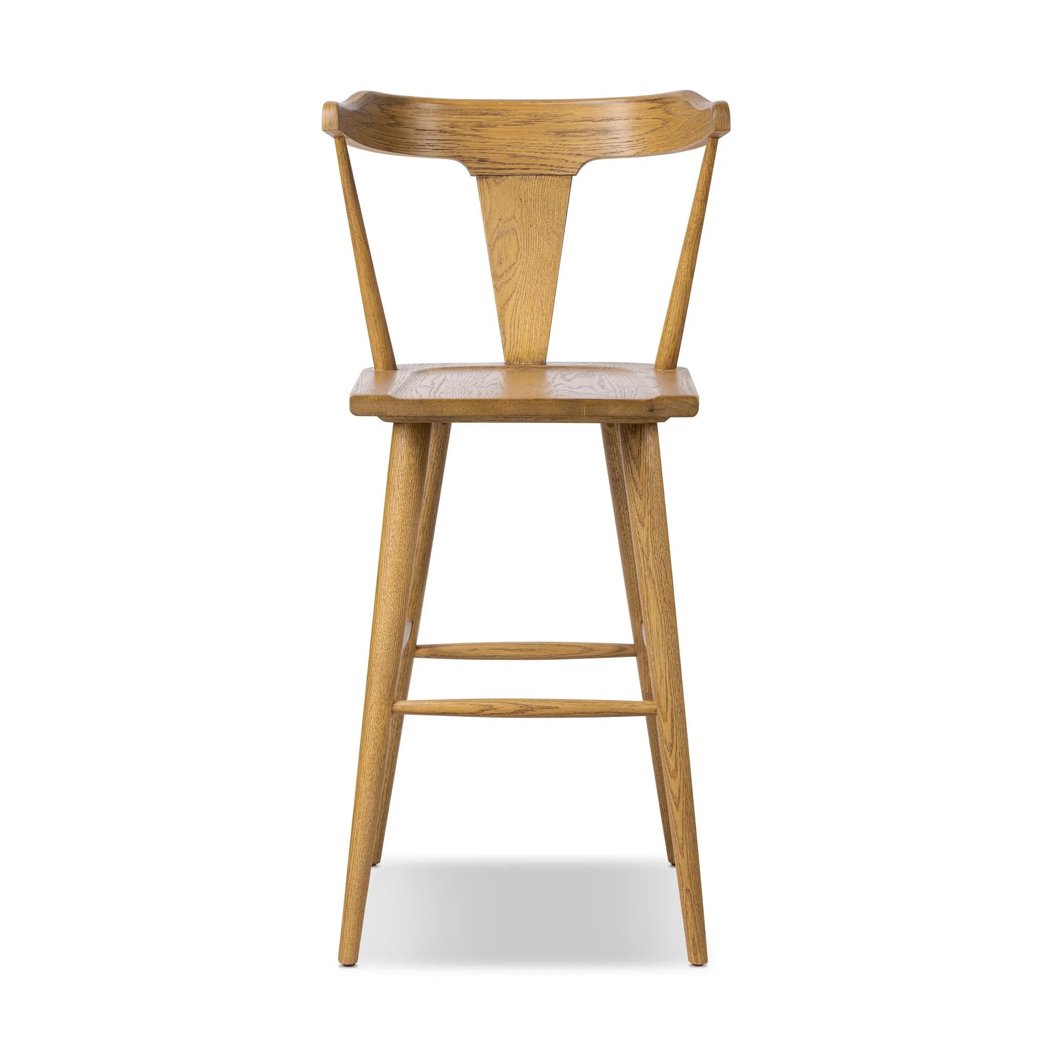 A fresh, bar-style take on mid-century Windsor seating, featuring a bowed, sculptural silhouette and soft black finish to highlight the natural grain of weathered oak Amethyst Home provides interior design, new home construction design consulting, vintage area rugs, and lighting in the Winter Garden metro area.