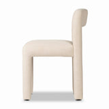 Fit for modern dining, this clean-styled chair is fully upholstered in a specialized performance fabric. An open back connects down to the cylindrical legs. Slight scale and squared off shape are great for smaller dining areas. Amethyst Home provides interior design, new home construction design consulting, vintage area rugs, and lighting in the San Diego metro area.