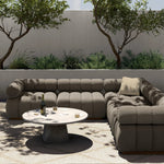 A modern take on mid-century Italian design, soft volume and exaggerated proportions fuse for a sculpted look and playful feel. Atop a plinth-style teak base, outdoor-friendly five-piece sectional features dramatic tufting for a padded sit, indoors and out. Amethyst Home provides interior design, new home construction design consulting, vintage area rugs, and lighting in the Boston metro area.