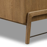 Amber-finished oak forms a clean silhouette with plenty of storage, accented with long iron hardware wrapped in black top-grain leather. Outset legs add an element of interest. Rear cutouts for cord management Amethyst Home provides interior design, new home construction design consulting, vintage area rugs, and lighting in the Seattle metro area.