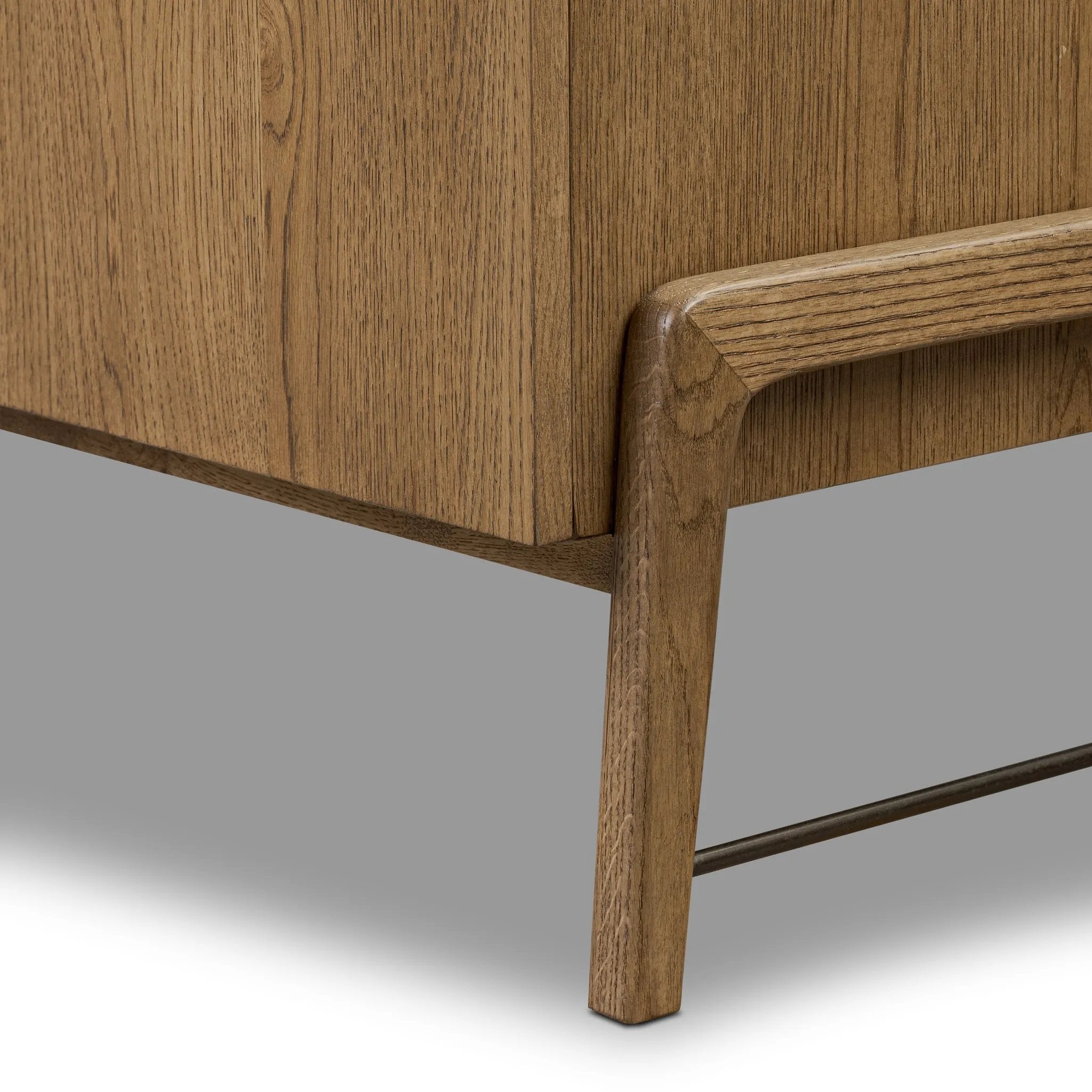 Amber-finished oak forms a clean silhouette with plenty of storage, accented with long iron hardware wrapped in black top-grain leather. Outset legs add an element of interest. Rear cutouts for cord management Amethyst Home provides interior design, new home construction design consulting, vintage area rugs, and lighting in the Seattle metro area.
