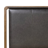 Amber-finished solid oak frames a floating, sling-style headboard made from black top-grain leather, with subtly rounded edges and metal dowel detailing Amethyst Home provides interior design, new home construction design consulting, vintage area rugs, and lighting in the Los Angeles metro area.