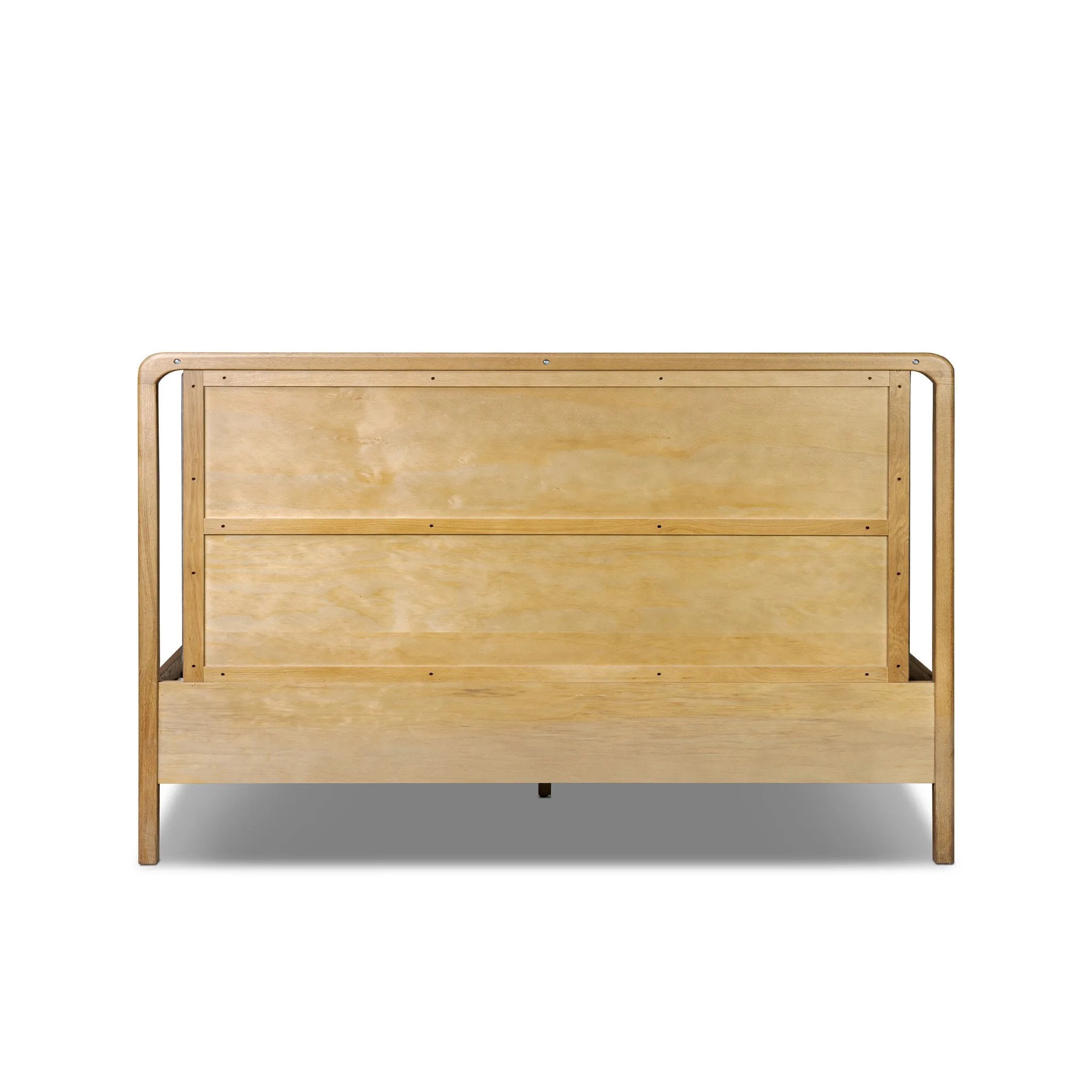 Amber-finished solid oak frames a floating, sling-style headboard made from black top-grain leather, with subtly rounded edges and metal dowel detailing Amethyst Home provides interior design, new home construction design consulting, vintage area rugs, and lighting in the Tampa metro area.