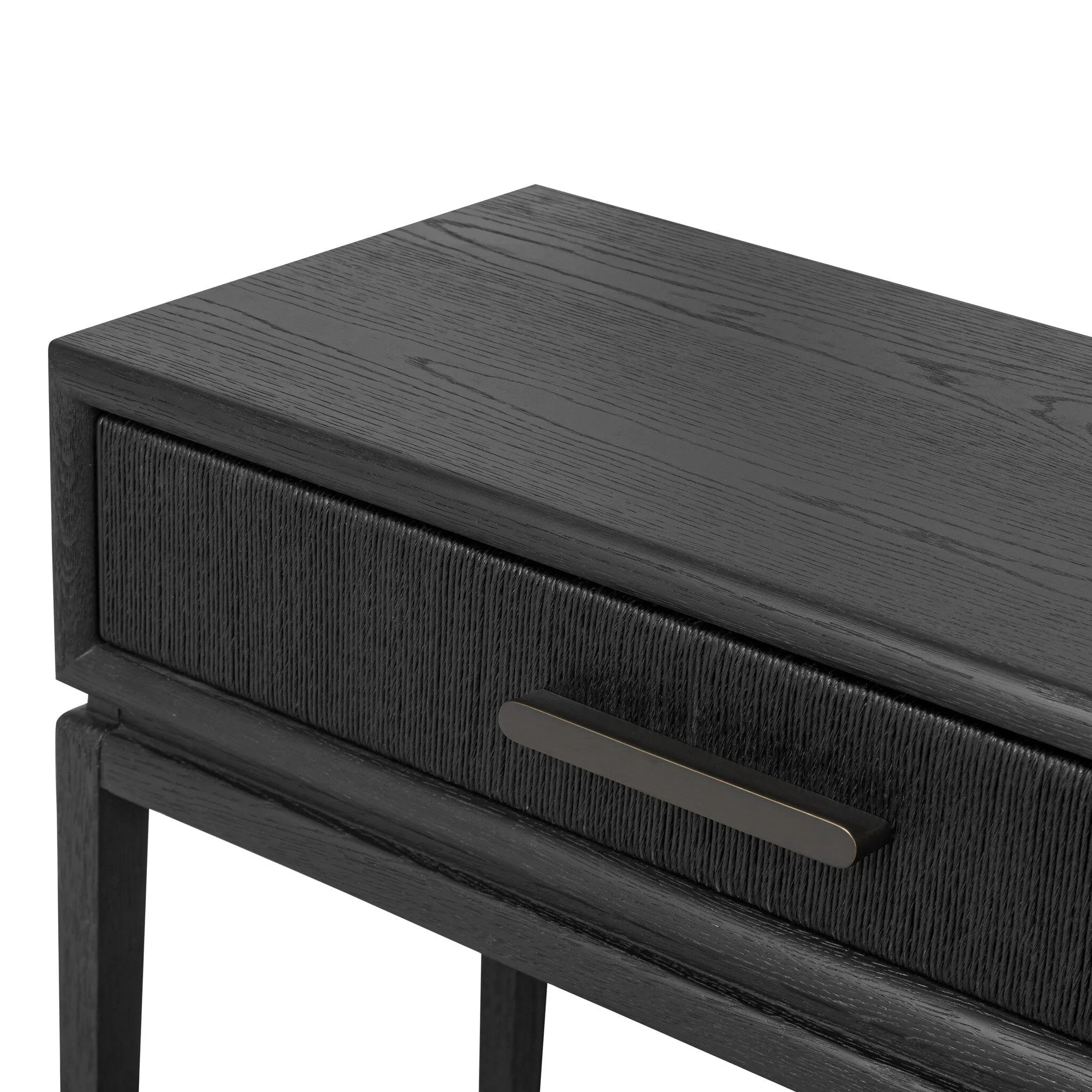 Featuring Rosenell Black Oak Veneer Console Table 60" by Four Hands at Amethyst Home. Elevate your living space or media room with a slim-profile console of black-finished oak. A smooth top pairs with two drawers covered with woven paper cord, while lower open shelving creates bonus storage and display options. The result: a dark, Scandinavian-inspired look th. Amethyst Home provides interior design, new home construction design consulting, vintage area rugs, and lighting in the Boston metro area.